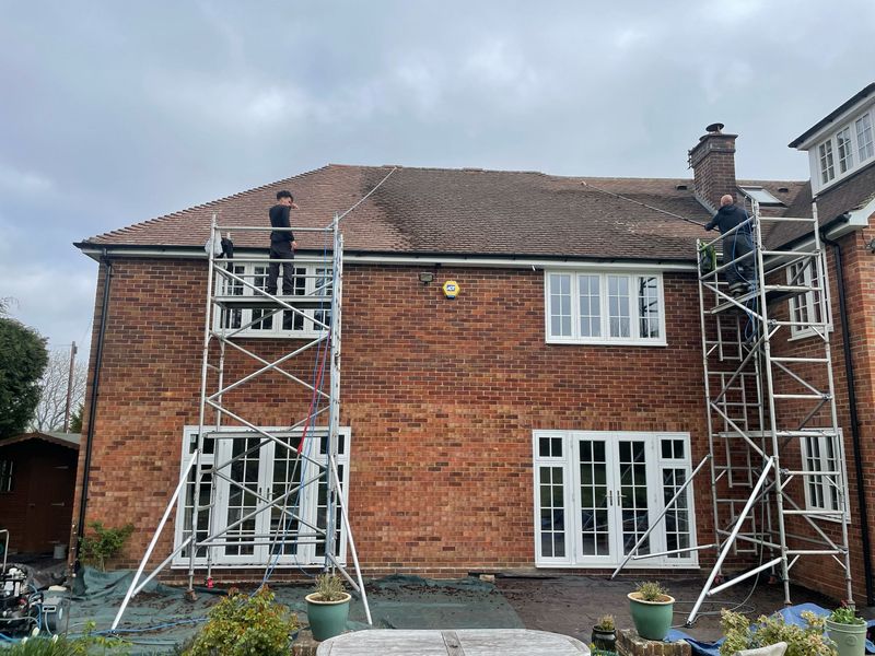 Roof cleaning carried out safely from scaffold towers by The Roof Moss Cleaners in Linton